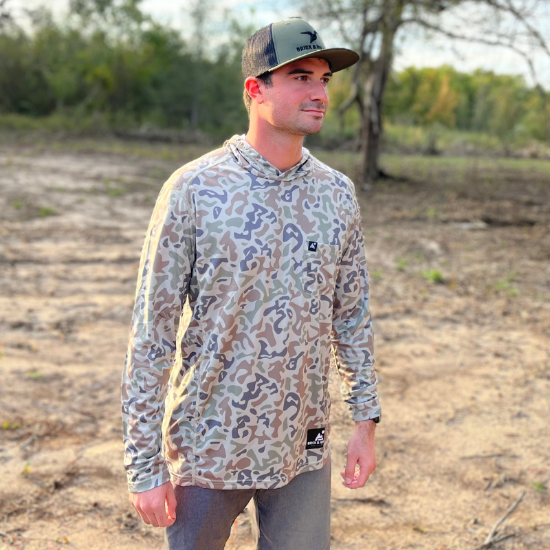 One of our custom designed camo shirts with small logo on front pocket and black label logo on left hip.